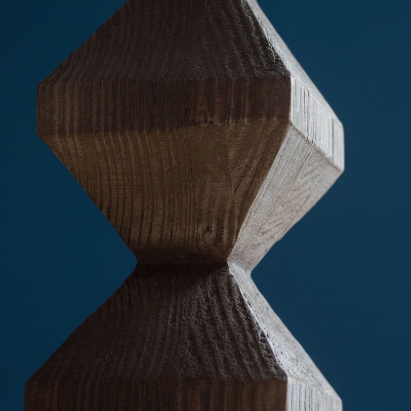Close-up of a textured brown and gray object with geometric design