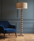 Decorative floor lamp in a room with a window and furniture
