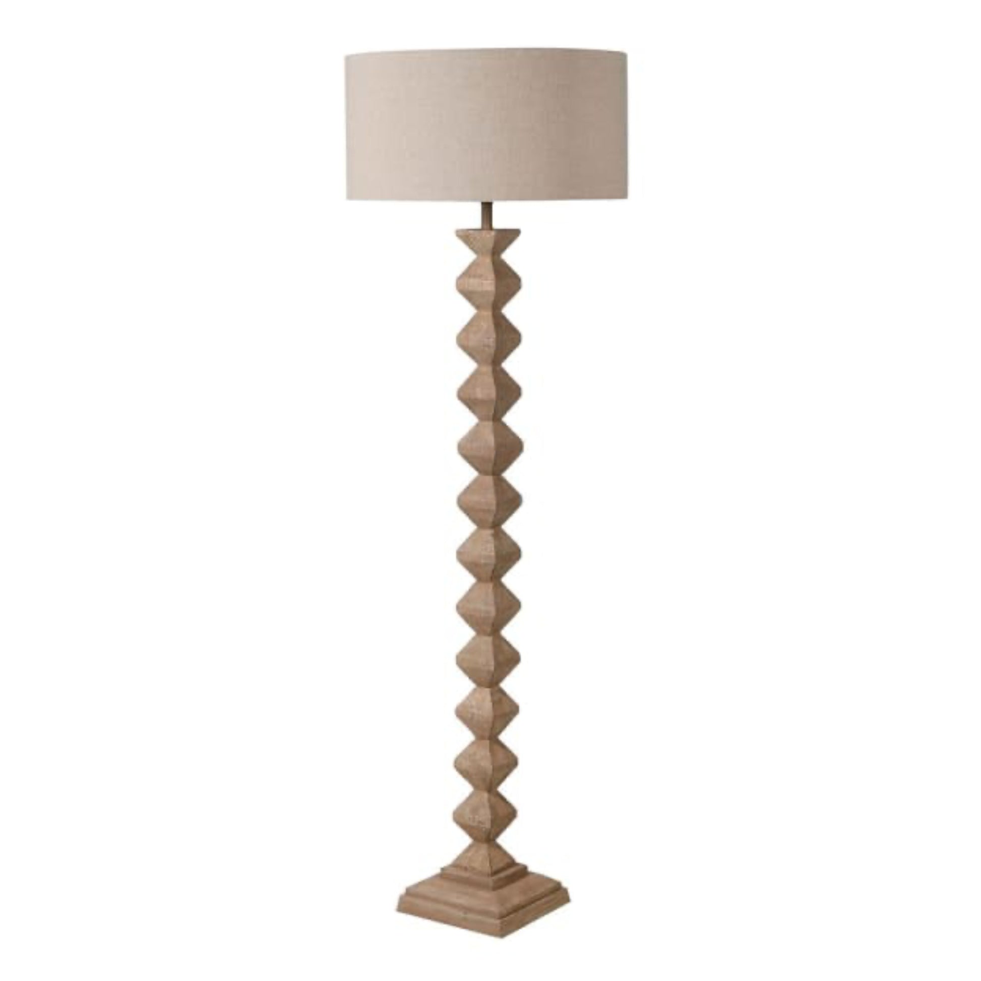 Floor lamp with a textured base and beige lampshade on a white background