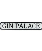 Decorative sign with 'GIN PALACE' text on a white background