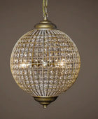 Decorative hanging light fixture with crystal details on a brown background