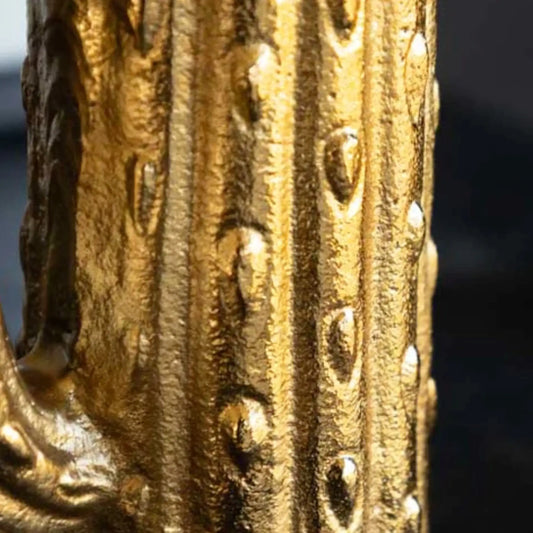 Close-up of a gold decorative object with intricate patterns