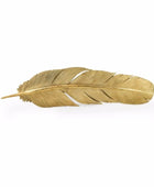 Gold feather-shaped object on a white background