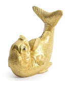 Gold fish figurine on a white background
