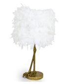 Decorative lamp with white feathered shade and gold base on a white background
