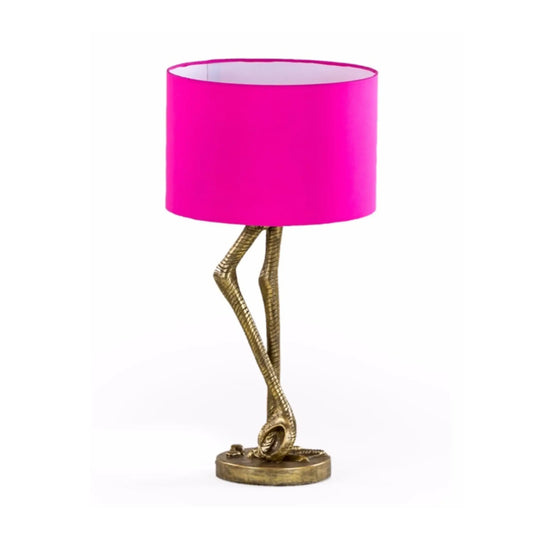 Table lamp with pink shade and gold base on a white background