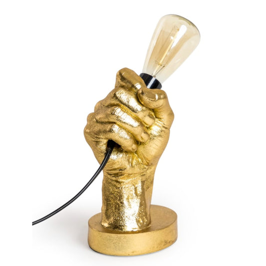Gold hand-shaped lamp with a light bulb on a white background