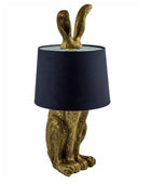 Decorative lamp with rabbit design and black lampshade on a white background