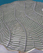 Close-up of a textured ceramic plate with wavy design