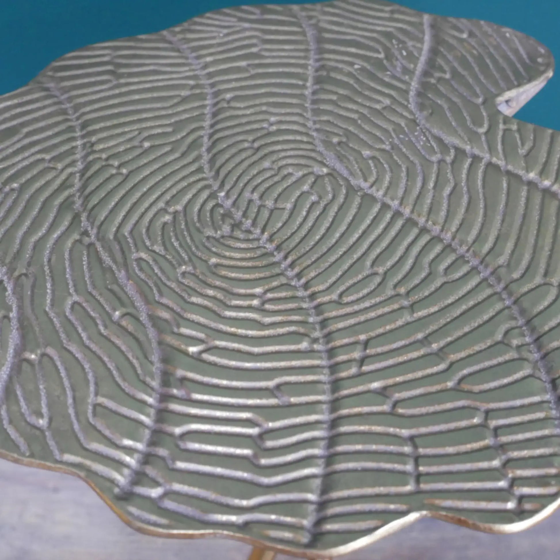 Close-up of a textured ceramic plate with wavy design