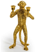 Gold monkey candle holder on a white background