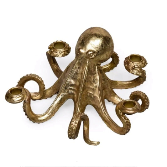 Gold octopus candle holder on a white background