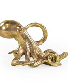 Bronze octopus sculpture on a white background