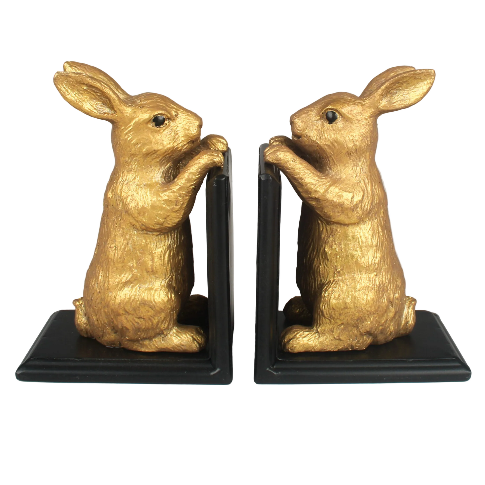 Gold rabbit bookends on a white background