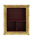 Decorative gold-framed shelf with a dark red interior on a white background