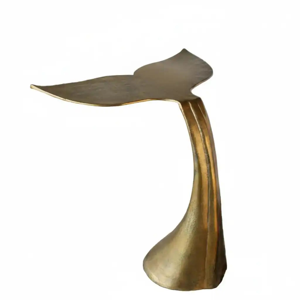 Bronze-colored tail-shaped object on a white background