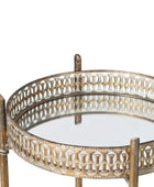 Round glass table with decorative metal frame on a white background