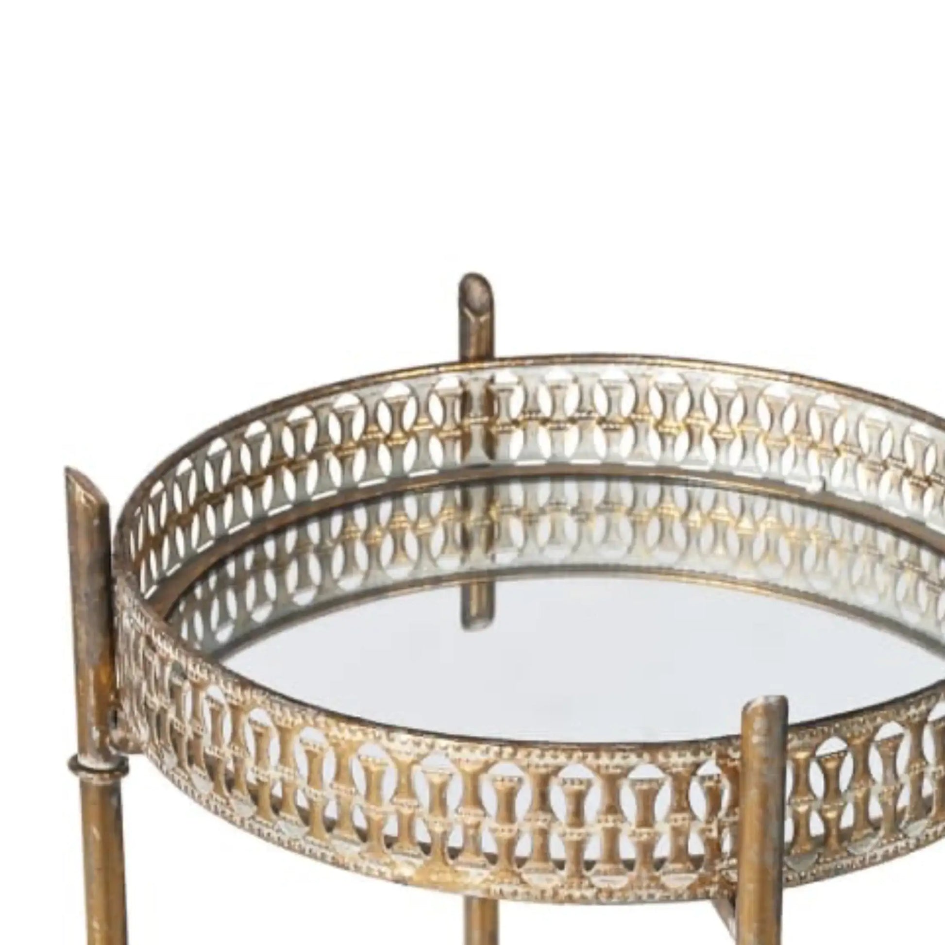 Round glass table with decorative metal frame on a white background