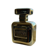 Gold perfume bottle on a white background