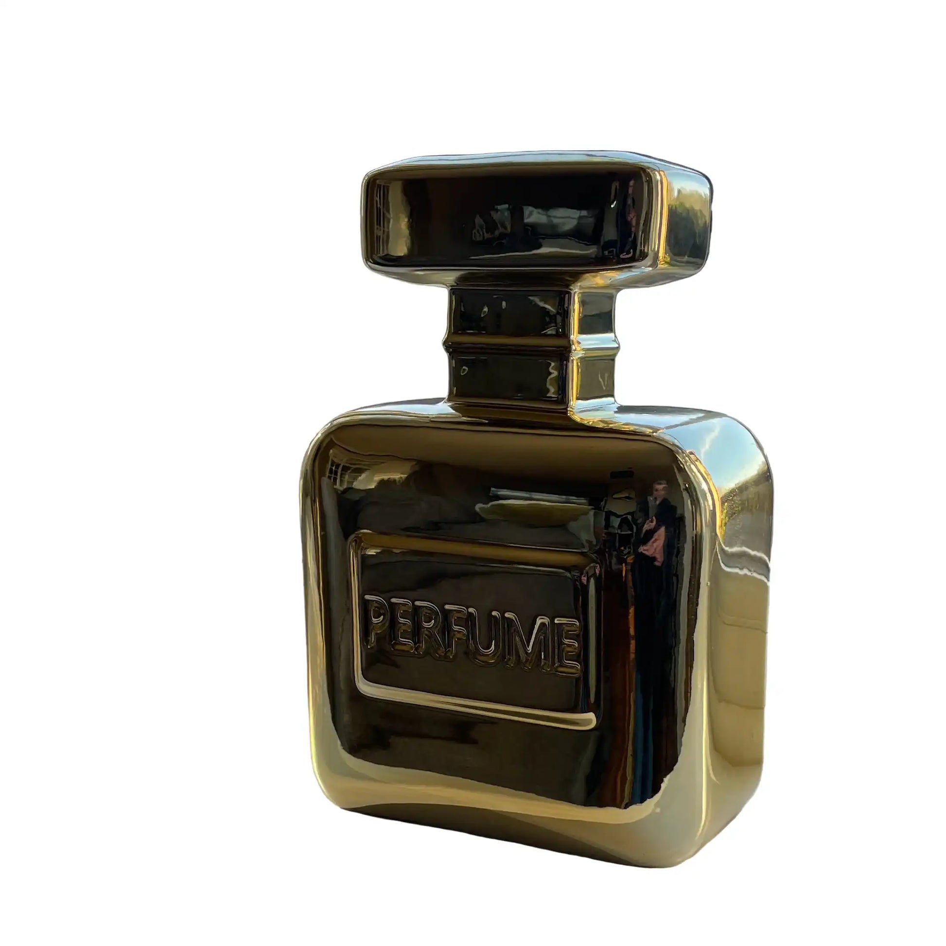 Gold perfume bottle on a white background