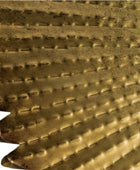 Close-up of a textured gold metal surface