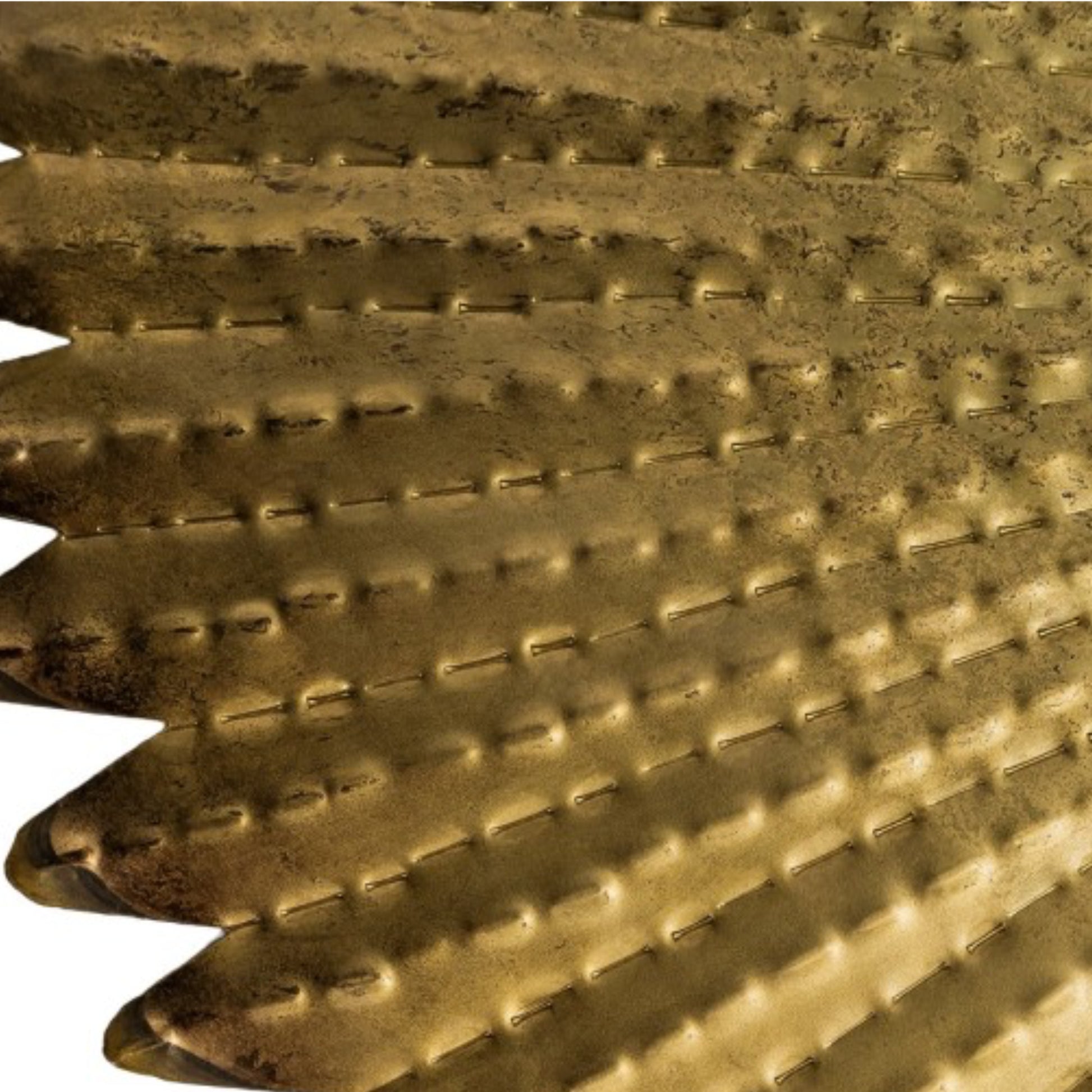 Close-up of a textured gold metal surface