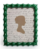 Green bamboo-style picture frame with a brown silhouette and text on a white background