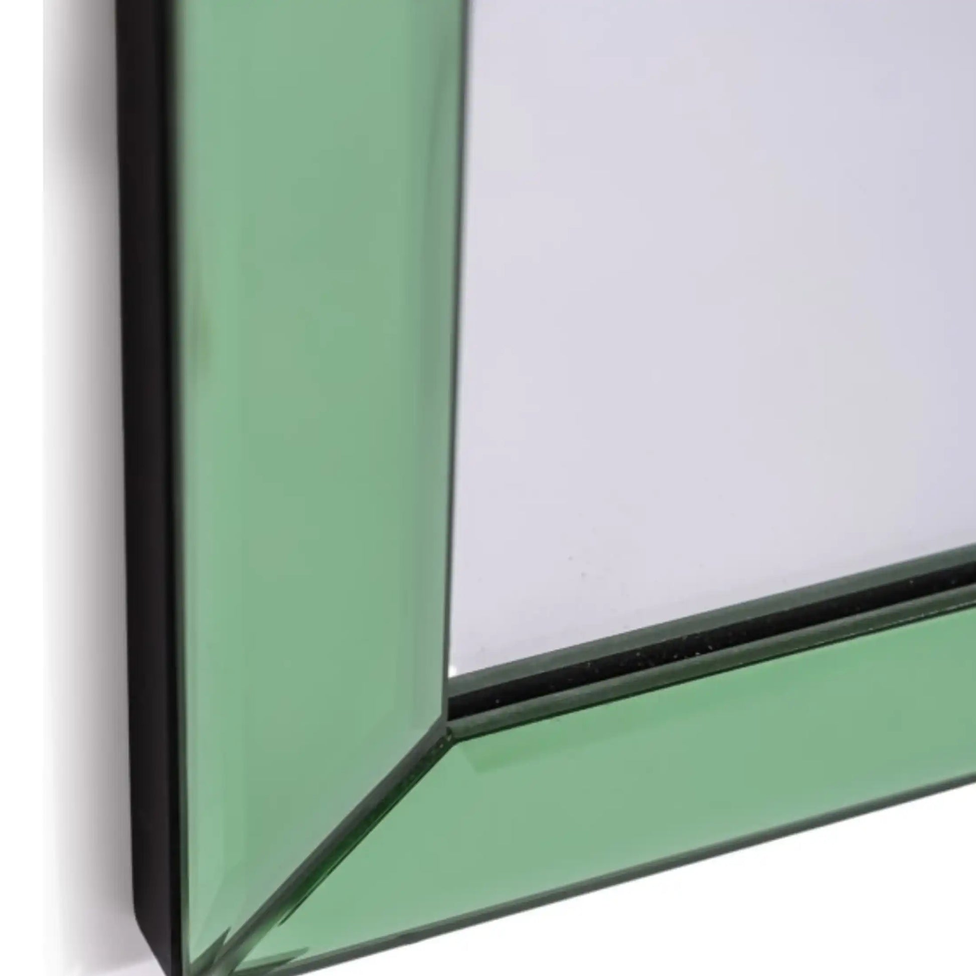 Close-up of a green glass panel with a black frame on a white background