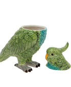 Green parrot-shaped planter with a smaller parrot figure on a white background
