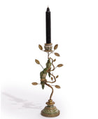 Decorative candle holder with birds and leaves on a white background
