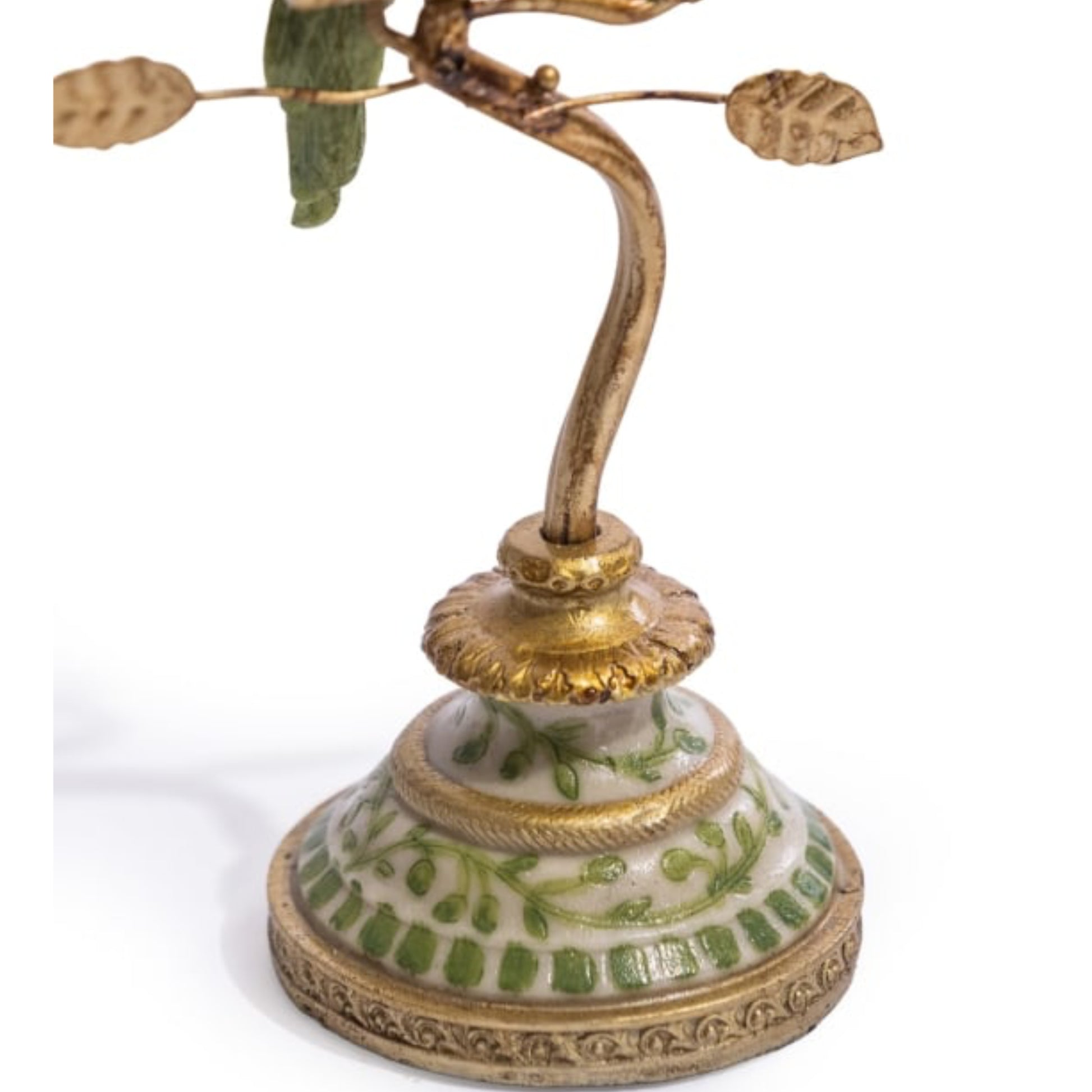 Decorative lamp with gold and green details on a white background