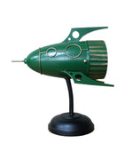 Green rocket ship model on a stand against a white background