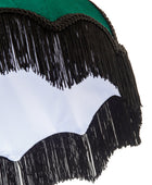 Close-up detail of a fringed garment or accessory with a green fabric top, black fringe trim, and a white scalloped section on a white background.
