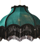 A vintage-style dome-shaped fabric lampshade in teal green with black fringe trim and black braided edging, shown against a plain white background.