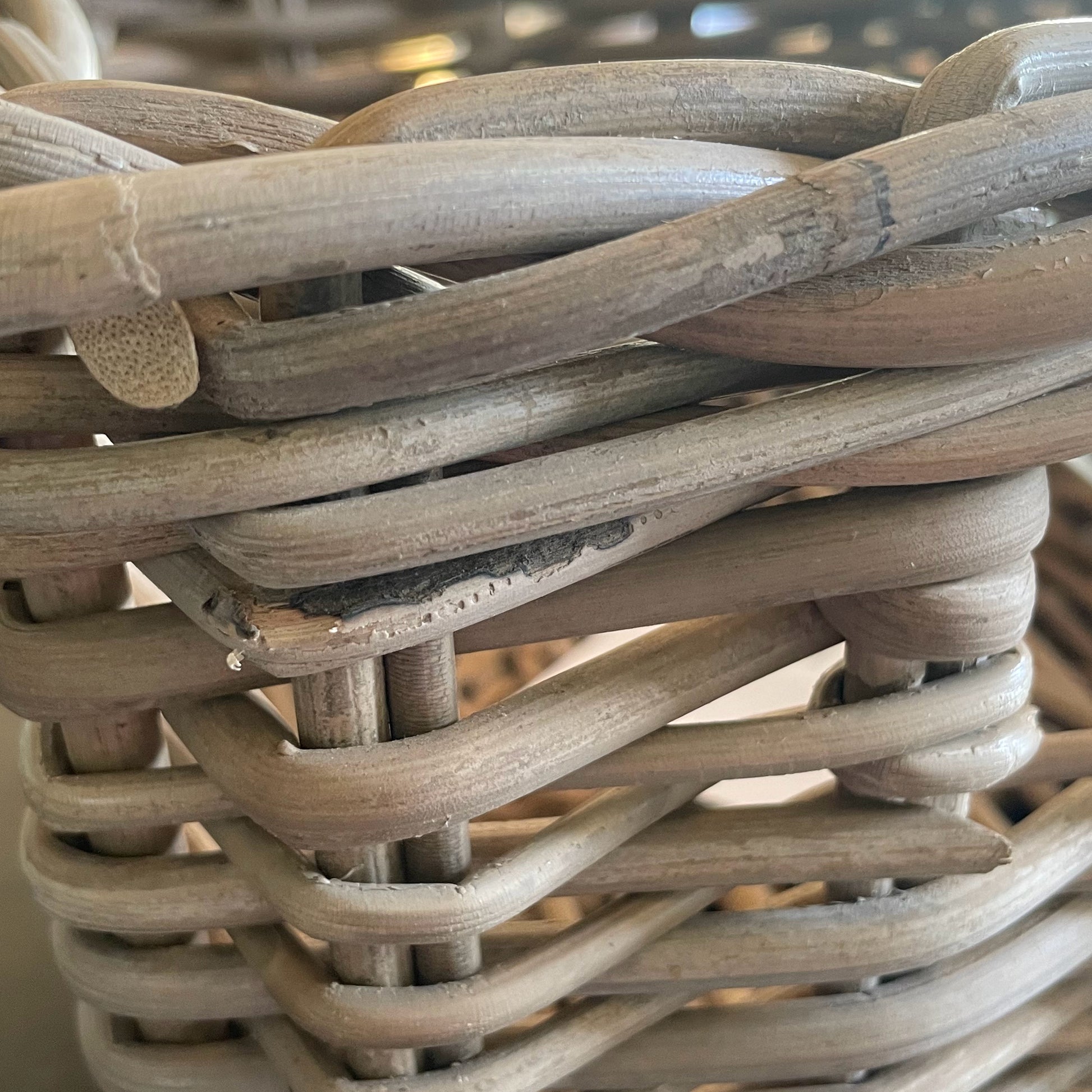 Close-up of a woven basket with natural wooden planks.
