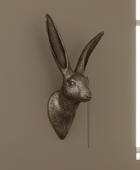 Decorative rabbit head mount on a beige wall