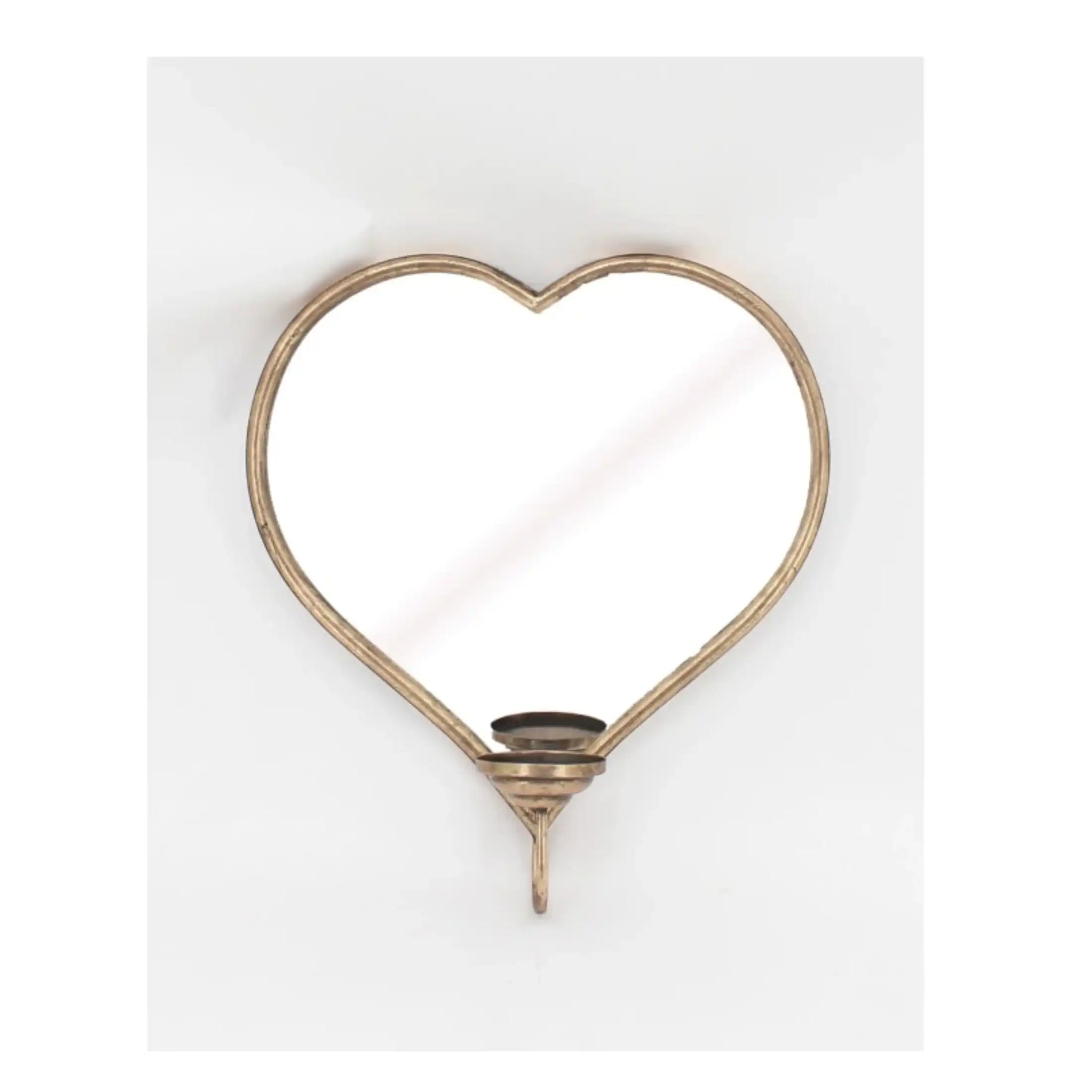 Heart-shaped mirror with a decorative base on a white background
