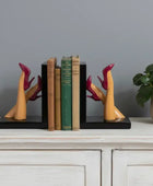 Bookends with high-heeled shoe design holding books on a white background