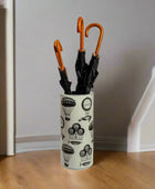 Umbrella holder with black umbrellas on a white background