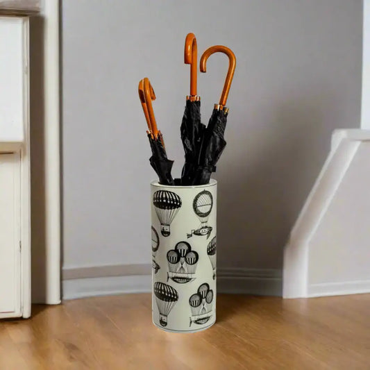 Umbrella holder with black umbrellas on a white background