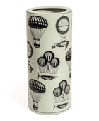 Umbrella stand with black hot air balloon design on a light background