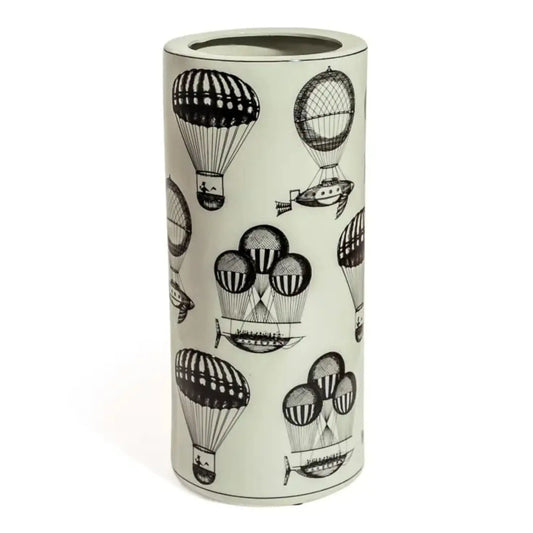 Umbrella stand with black hot air balloon design on a light background