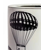 Ceramic mug with black and white parachute design on a white background