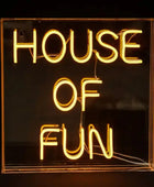Neon sign with 'HOUSE OF FUN' text on a black background