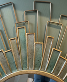 Decorative wall art with rectangular metal panels on a plain background