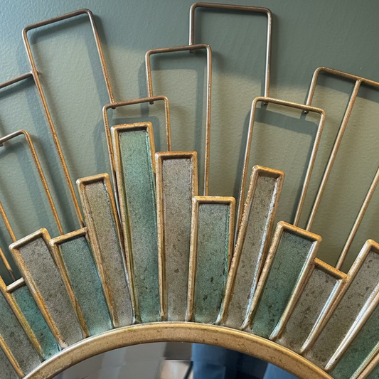 Decorative wall art with rectangular metal panels on a plain background