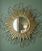 Decorative wall mirror with geometric design on a green wall