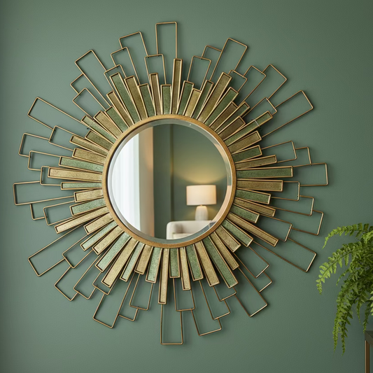 Decorative wall mirror with geometric design on a green wall