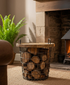 Wooden basket with logs in front of a fireplace