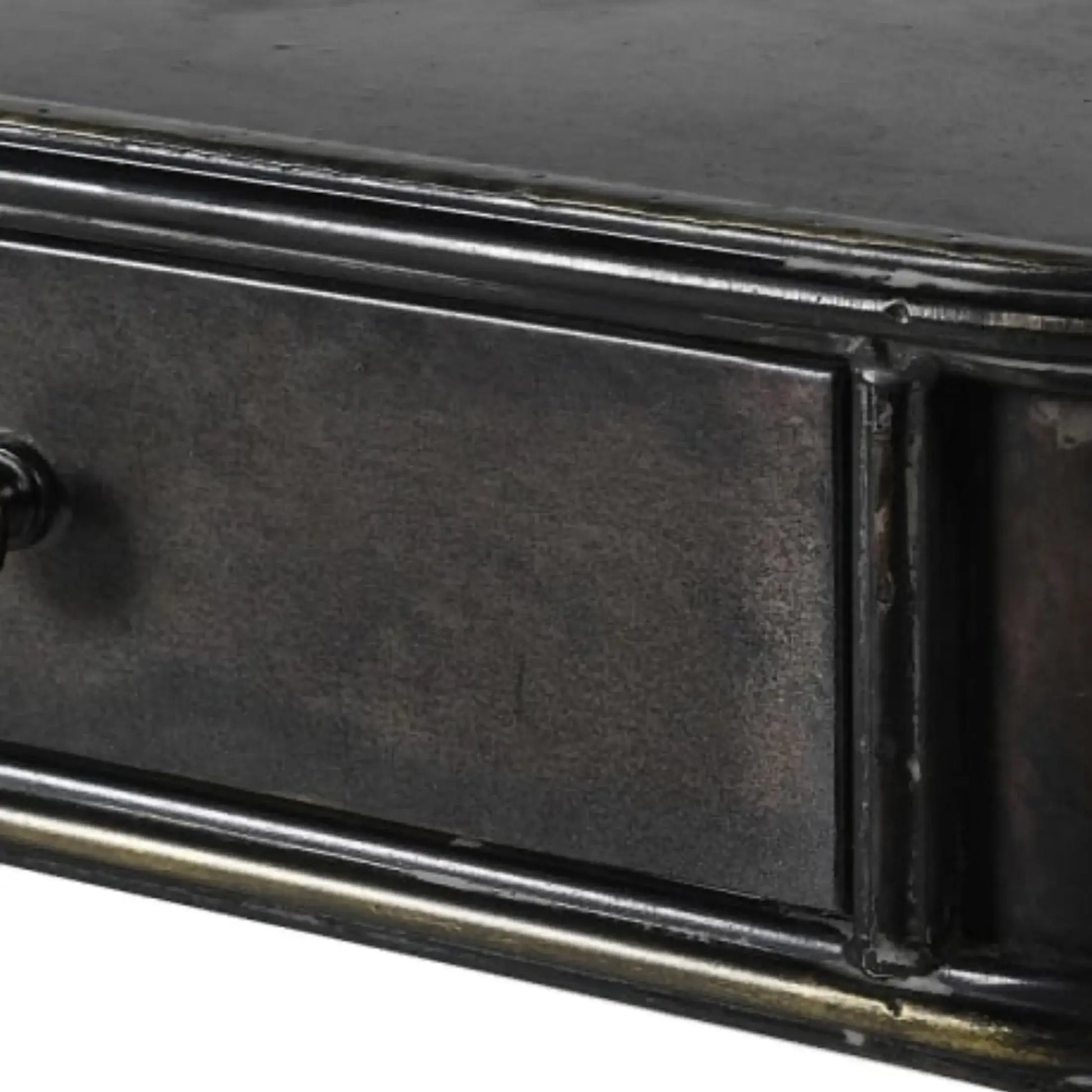 Close-up of a black metal drawer with a white background